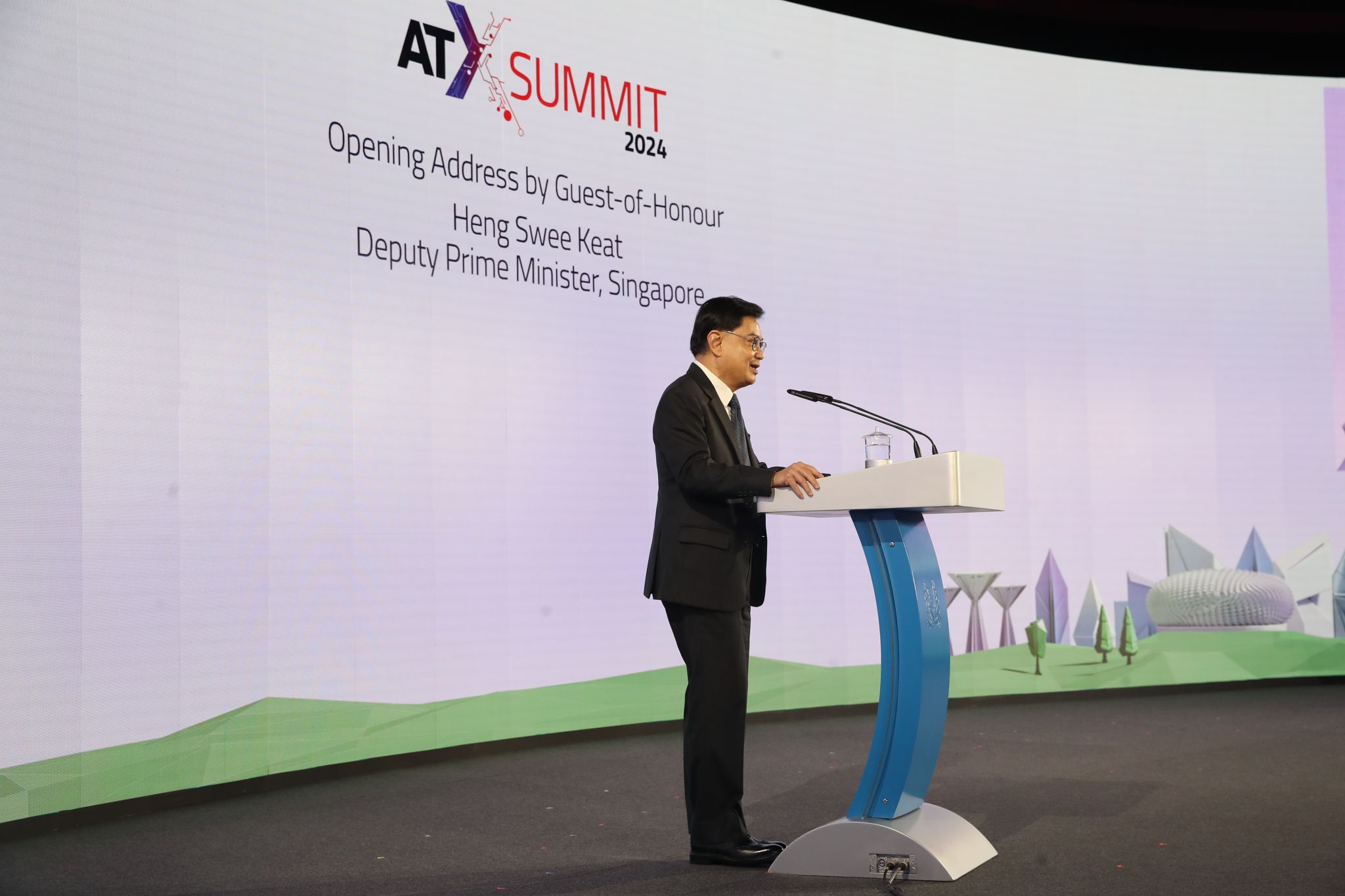 Singapore Deputy Prime Minister Mr Heng Swee Keat on stage at the Asia Tech x Summit on 30 May 2024. The backdrop announces the Opening Address by Guest-of-Honour Mr Heng.